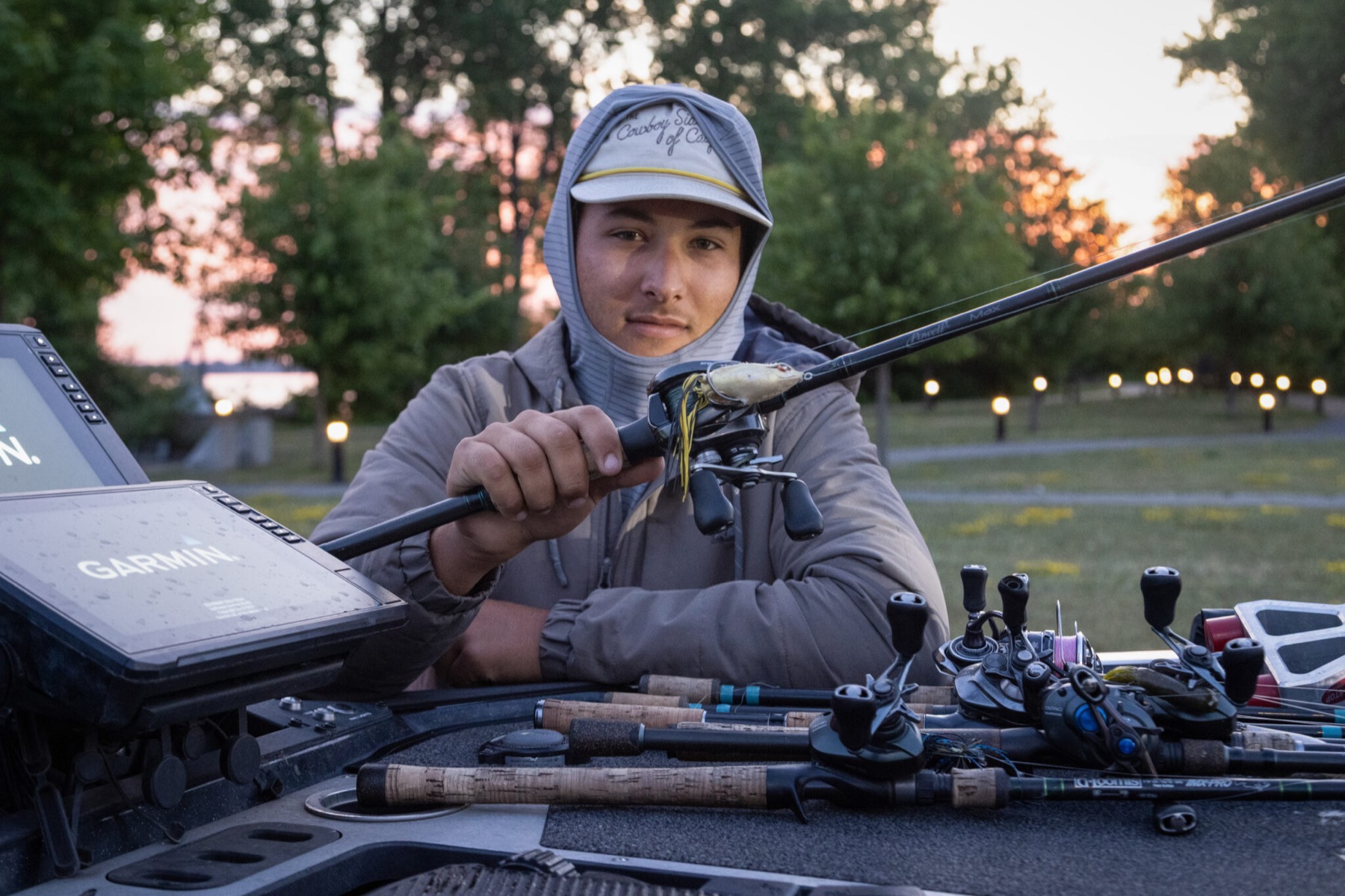 Kyle Goldstein at the helm at first light, rods and reels laid out across the deck beside a Garmin unit